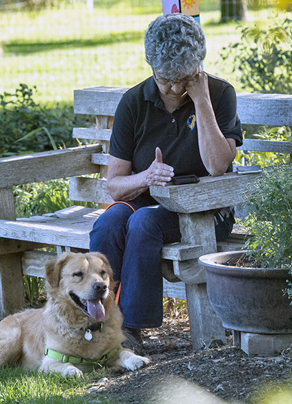 A woman sitting with her dog